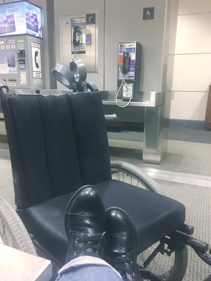 Someone resting feet up on an empty wheelchair