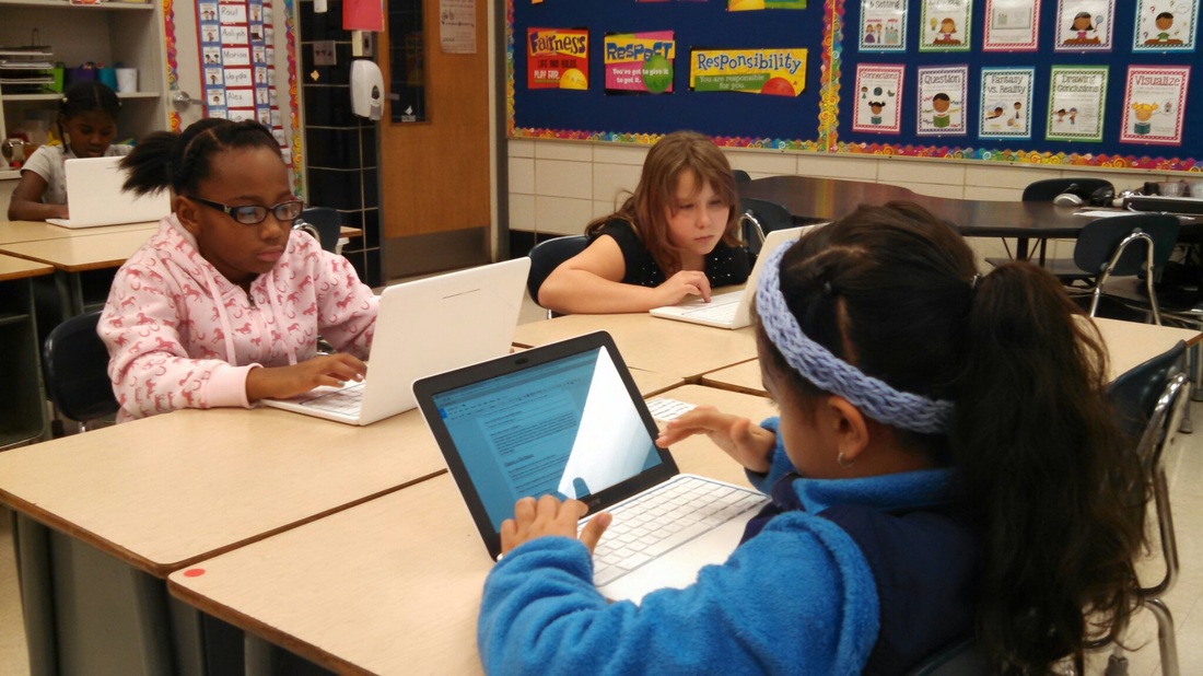 Students using Google Chromebooks to access Google Drive