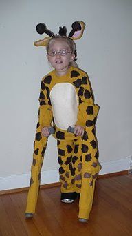 Girl in a giraffe costume. Her crutches make up the front long legs