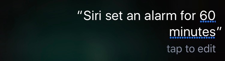 Black background, white text. Text says, Siri set an alarm for 60 minutes.