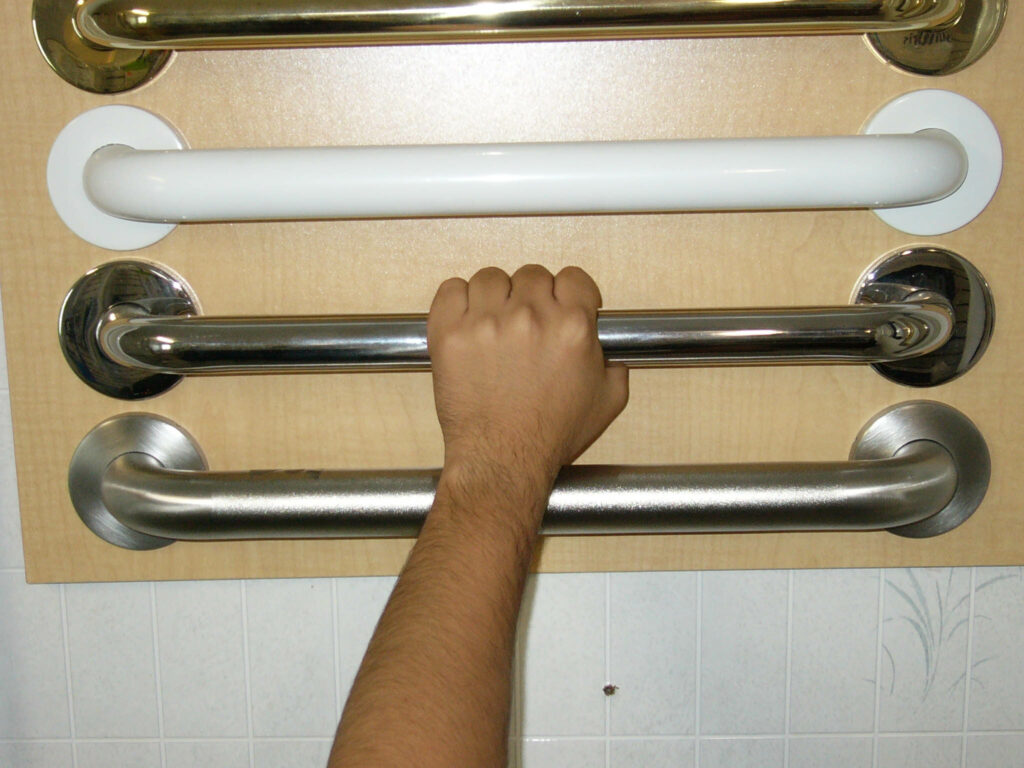 4 different color grab bars with arm and hand grasping one